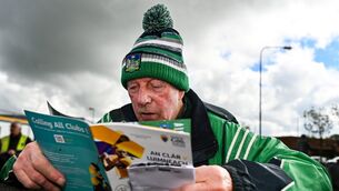 <p>Limerick supporter Jack Dillon from Galbally reads his match programme as he awaits the turnstiles to be opened before the Munster GAA Senior Hurling Championship Round 3 match between Clare and Limerick at Zimmer Biomet Páirc Chíosóg in Ennis, Clare. Photo by Tom Beary/Sportsfile</p>