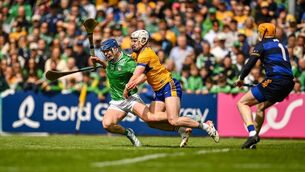 <p>Shane O'Brien of Limerick is fouled by Adam Hogan of Clare. Pic: Tom Beary/Sportsfile</p>