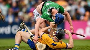 <p>Shane O'Brien of Limerick tussels with David McInerney of Clare during the Munster GAA Senior Hurling Championship Round 3 match between Clare and Limerick at Zimmer Biomet Páirc Chíosóg in Ennis, Clare. Photo by Tom Beary/Sportsfile</p>