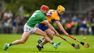 <p>GROUND GAME: Mark Rodgers of Clare in action against Barry Nash of Limerick. Pic: Brendan Moran/Sportsfile</p>