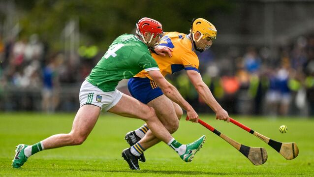 <p>GROUND GAME: Mark Rodgers of Clare in action against Barry Nash of Limerick. Pic: Brendan Moran/Sportsfile</p>