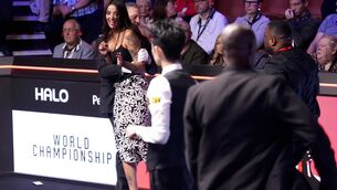 <p>Referee Rob Spencer prevents a spectator from encroaching on the table in the World Championship final (Mike Egerton/PA)</p>