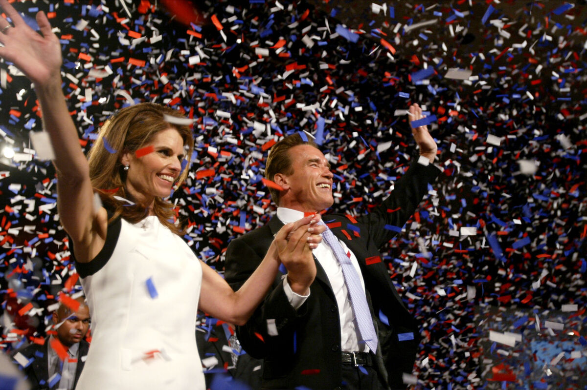 Newly elected California Governor Arnold Schwarznegger waves to supporters from the stage following his victory in the California Recall Election at the Century Plaza Hotel October 7, 2003. Picture: Mario Tama/Getty