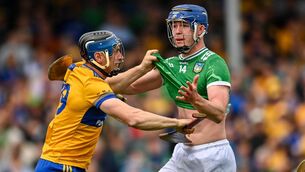 <p>GRASPING FOR COMFORT: Shane O'Brien of Limerick tussles with David McInerney of Clare during the Munster GAA Senior Hurling Championship Round 3 match between Clare and Limerick at Zimmer Biomet Páirc Chíosóg in Ennis, Clare. Pic: Tom Beary/Sportsfile</p>
