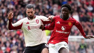 <p>BOSSING THE MIDDLE: Liverpool's Dominik Szoboszlai (left) and Manchester United's Kobbie Mainoo battle for the ball during the Premier League match at Old Trafford, Manchester. Pic: Martin Rickett/PA Wire</p>