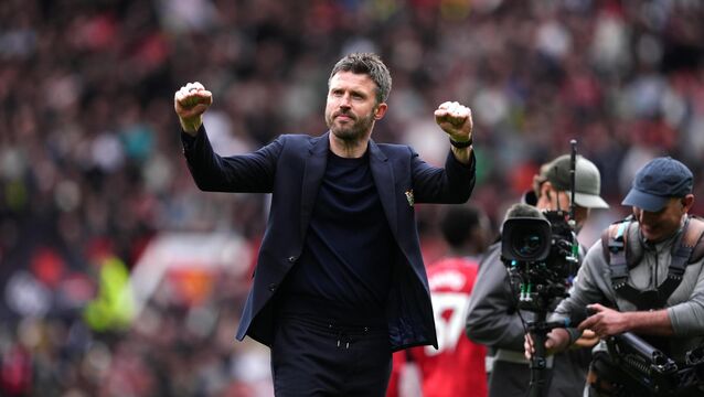 <p>Michael Carrick celebrates the win over Liverpool. Pic: Martin Rickett/PA</p>