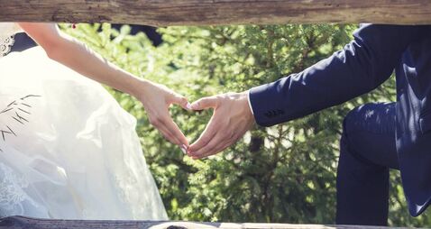 Man and woman couple holding hands on a romantic