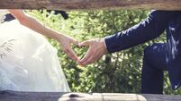 Man and woman couple holding hands on a romantic