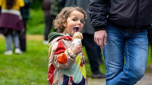 <p>Tarron Makkadoddle enjoys an ice cream at the May Sunday Festival in Killeagh, making the most of the day despite the wet weather. Picture: Chani Anderson</p>