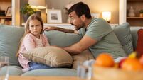 Parenting Moment: Dad Addressing His Child's Misbehavior at Home