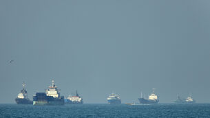 Cargo ships are stranded in the Strait of Hormuz (Amirhosein Khorgooi/ISNA via AP)