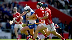 <p>MUNSTER MADNESS: Stephen Bennett is tackled by Cork players Mark Coleman and Seán O’Donoghue. Pic: Brendan Moran/Sportsfile.</p>