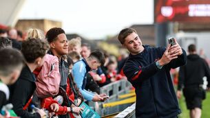 <p>Munster's Jack Crowley takes a selfie with a fan at Thomond Park. Pic: INPHO/Dan Sheridan</p>