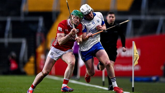 <p>Shane Bennett of Waterford is tackled by Cormac O'Brien of Cork. Pic: Ben McShane/Sportsfile</p>
