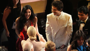 <p>Kylie Jenner (left) and Timothee Chalamet (right) greet Elle Fanning at the Oscars in March. He did not win an award. Whether or not it was because of his comments about opera and ballet one cannot be sure, but it certainly did not help his case. Photo: AP/Chris Pizzello</p>