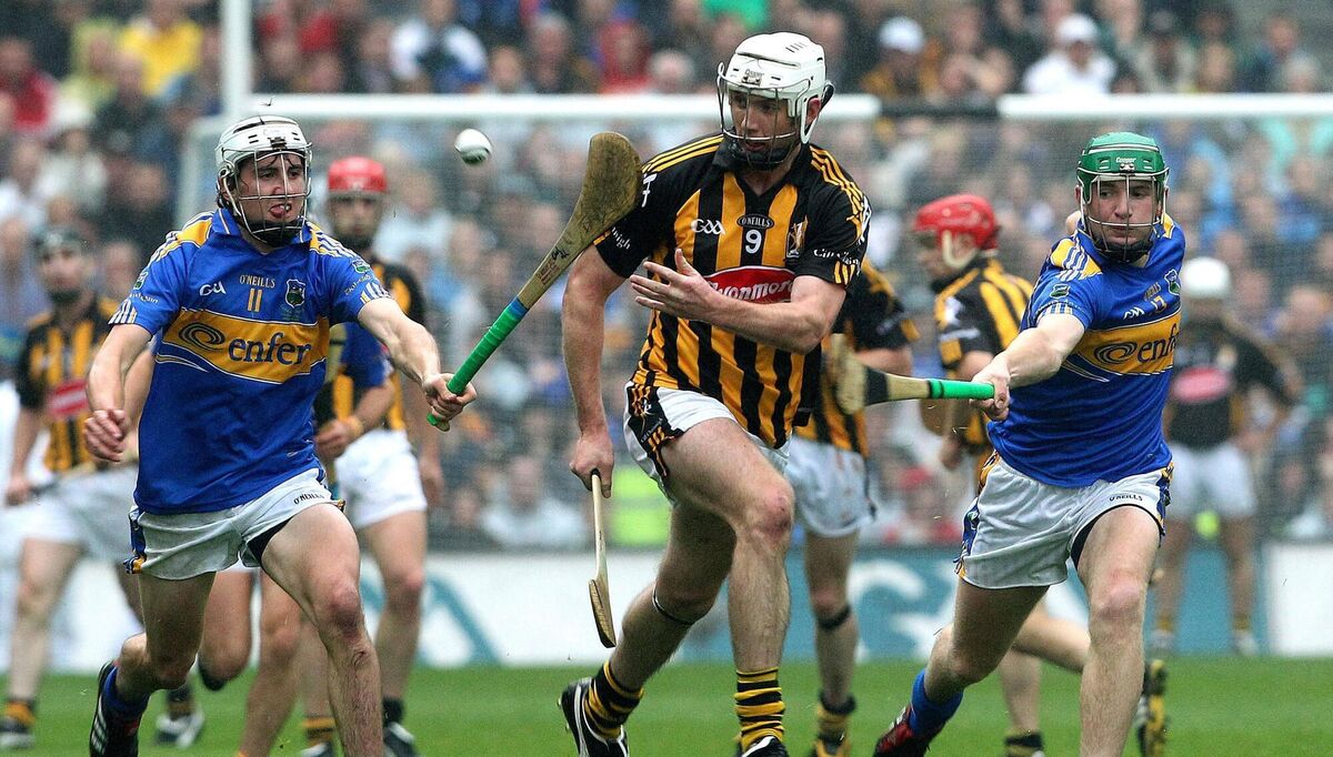 Kilkenny's Michael Fennelly tackled by Tipp's Patrick Maher and Noel McGrath. Pic: ©INPHO/Lorraine O'Sullivan.