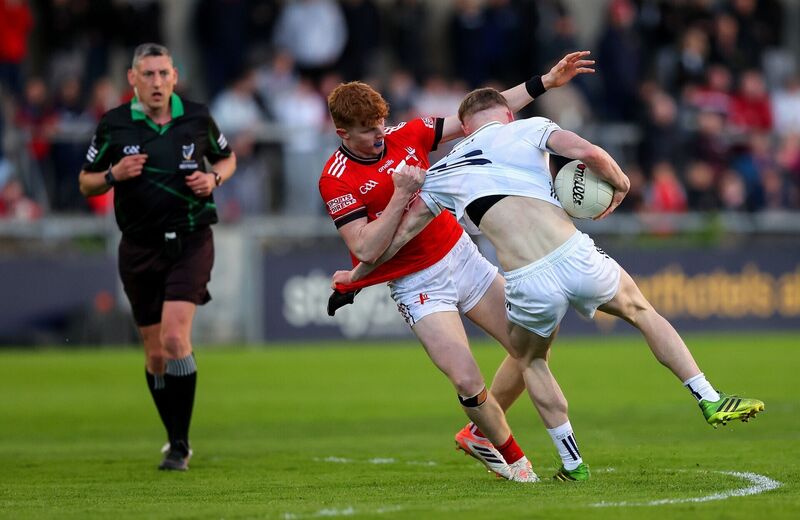 Kildare's Ronan Kelly with Padric Tinnelly of Louth. Pic: ©INPHO/Tom O’Hanlon.