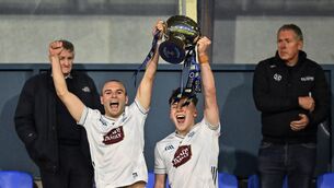 <p>CHAMPIONS: Kildare joint-captains Ben Ryan and Colm Moran lift the cup. Pic: Piaras Ó Mídheach/Sportsfile.</p>