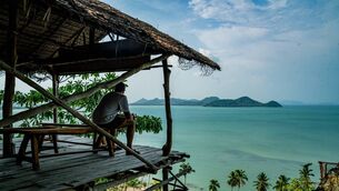 <p>Kai scans the bay from a height on Koh Yao Yai. Pictures: Chani Anderson (courtesy of her personal collection).</p>