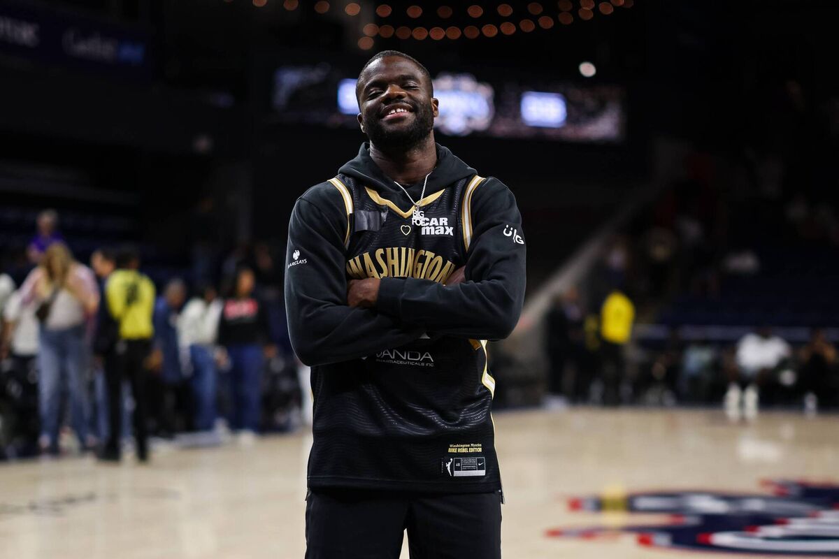 KEEN SUPPORTER: Tennis player Frances Tiafoe stands on the court after the WNBA game between the Washington Mystics and the Phoenix Mercury at CareFirst Arena. Pic: Scott Taetsch/Getty Images