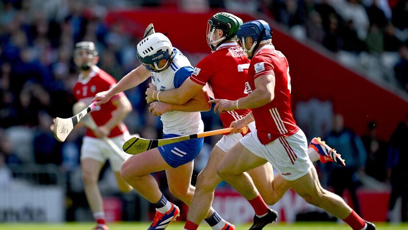 Stephen Bennett of Waterford is tackled by Cork players Mark Coleman, left, and Seán O’Donoghue. Pic: Brendan Moran/Sportsfile