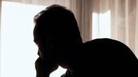 Silhouette of depressed, sad and lonely man in the apartment.