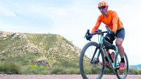 Man riding gravel bike on mountain trail exploring outdoors