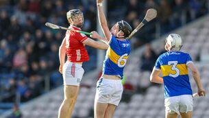 <p>Tipperary vs Cork in the Munster Minor Hurling Championship in Semple Stadium Thurles Cork's Cormac Murphy and Tipperary's James Finn, Daniel Groome</p>
