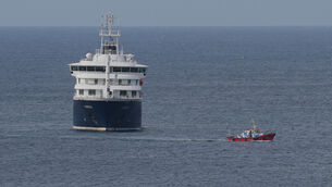 <p>The MV Hondius cruise ship anchored at a port in Praia, Cape Verde on Wednesday. Picture: AP Photo/Misper Apawu</p>