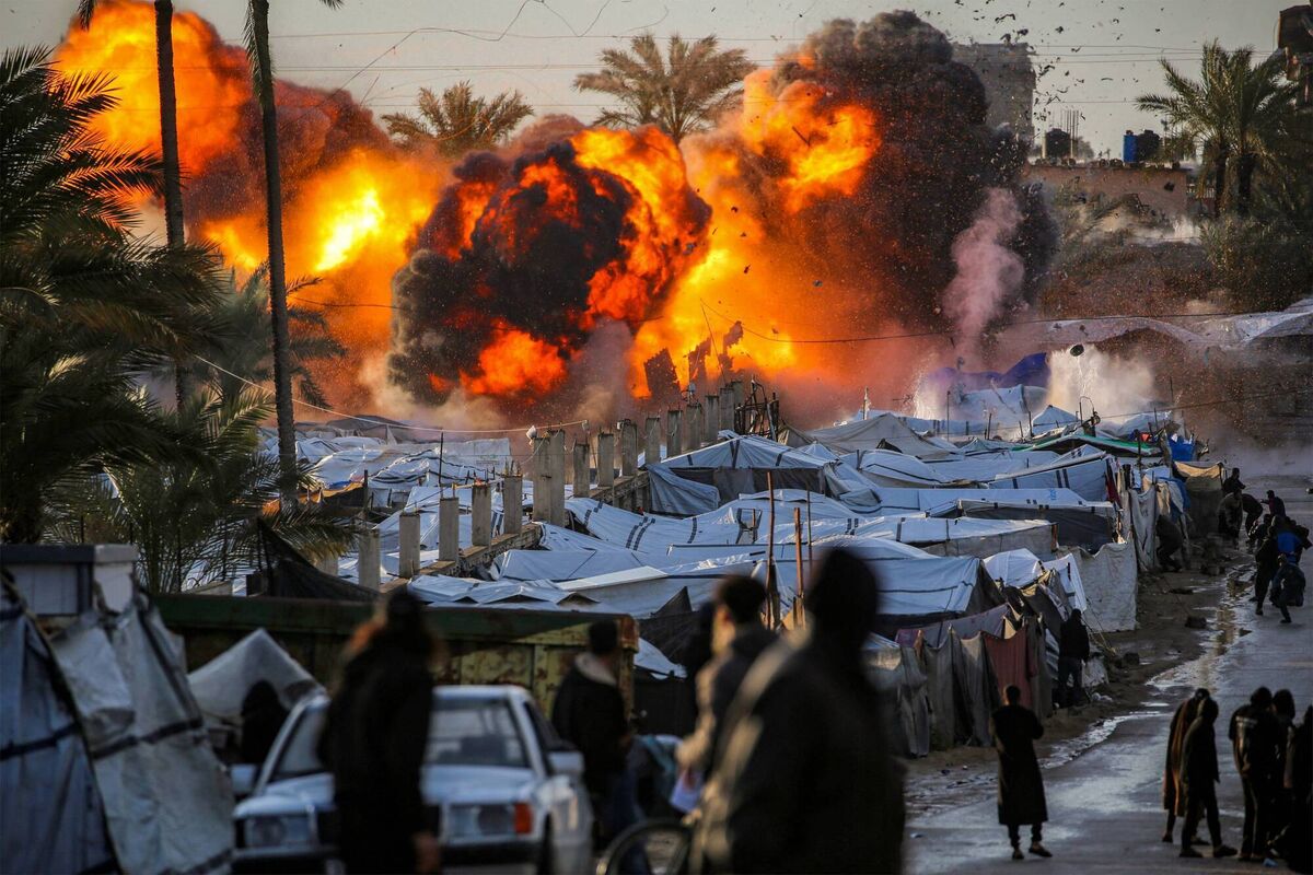 A fireball erupts following an Israeli strike near a tent encampment sheltering people displaced by war in Deir el-Balah in Gaza on March 25 during the ceasefire which came into effect on October 10. Picture: Eyad Baba/AFP/Getty