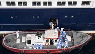 <p>Health personnel assisting patients onto a boat from the cruise ship MV Hondius, while stationary off the port of Praia, the capital of Cape Verde. Picture: AFP via Getty Images</p>