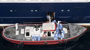 <p>Health personnel assisting patients onto a boat from the cruise ship MV Hondius, while stationary off the port of Praia, the capital of Cape Verde. Picture: AFP via Getty Images</p>