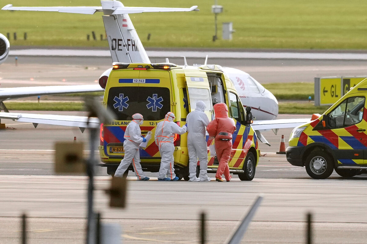 Medics escort patients evacuated from the MV Hondius cruise ship to an ambulance after being flown to Schiphol airport, Amsterdam, Netherlands. Picture: Peter Dejong/AP Medics escort patients evacuated from the MV Hondius cruise ship to an ambulance after being flown to Schiphol airport, Amsterdam, Netherlands. Picture: Peter Dejong/AP