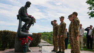 <p>Ukrainian army officers at a monument to pilots to mark Victory Day in the Second World War, in Kyiv, Ukraine (Efrem Lukatsky/AP)</p>
