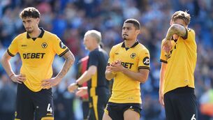 <p>Wolverhampton Wanderers' Andre (centre), Santiago Bueno and David Moller Wolfe (right) after the Premier League match at the American Express Stadium. Pic: John Walton/PA Wire.</p>