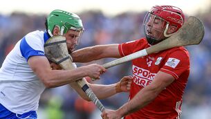 <p>FACE OFF: Cork's William Buckley gets to grips with Waterford's Conor Keane. Pic: INPHO</p>
