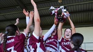 <p>Galway's Cara Giblin and Ciara Mullins lift the Kate Moran Cup. Pic: ©INPHO/Grace Halton</p>