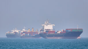 <p>Container ships sit at anchor in the Strait of Hormuz off Bandar Abbas, Iran, Saturday, May 2, 2026.(Amirhosein Khorgooi/ISNA via AP)</p>