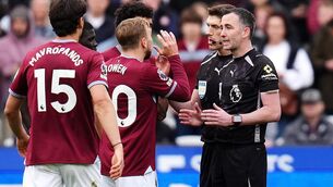 <p>West Ham United's Jarrod Bowen and team-mates surround referee Chris Kavanagh. Pic: John Walton/PA Wire.</p>