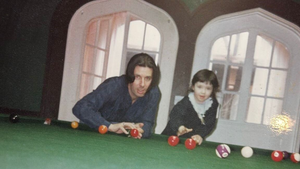 Lottie Ryan (right) with her father Gerry in 1990 at the family home. 'A mad house, in the best possible way'.