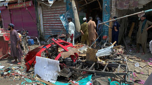 Local residents examine damage at the site of a bomb explosion at a market in Sarai Norag in Lakki Marwat (AP Photo/Farhat Ullah) Local residents examine damage at the site of a bomb explosion at a market in Sarai Norag in Lakki Marwat (AP Photo/Farhat Ullah)