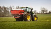 Tractor spraying crops