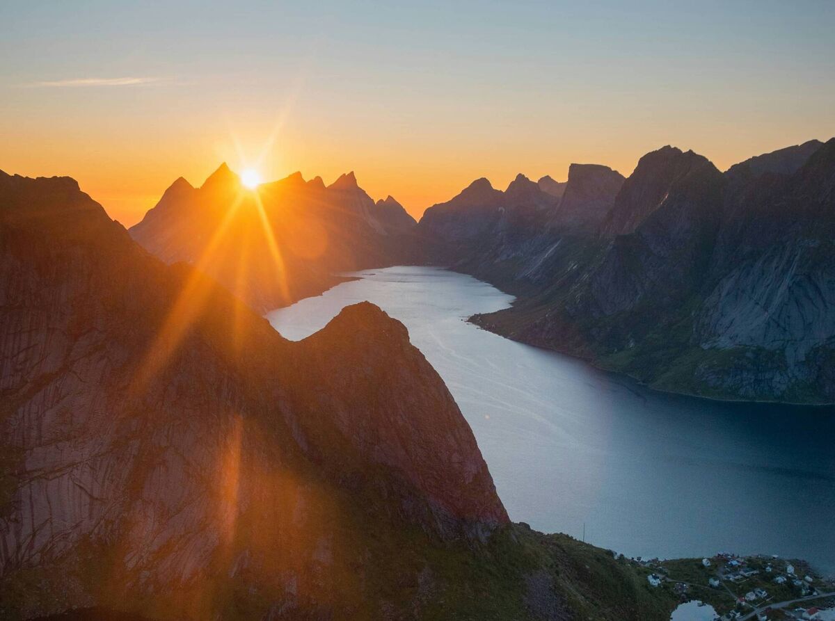 The Lofoten Islands in summer, where long daylight hours stretch across fjords, fishing villages and open water.