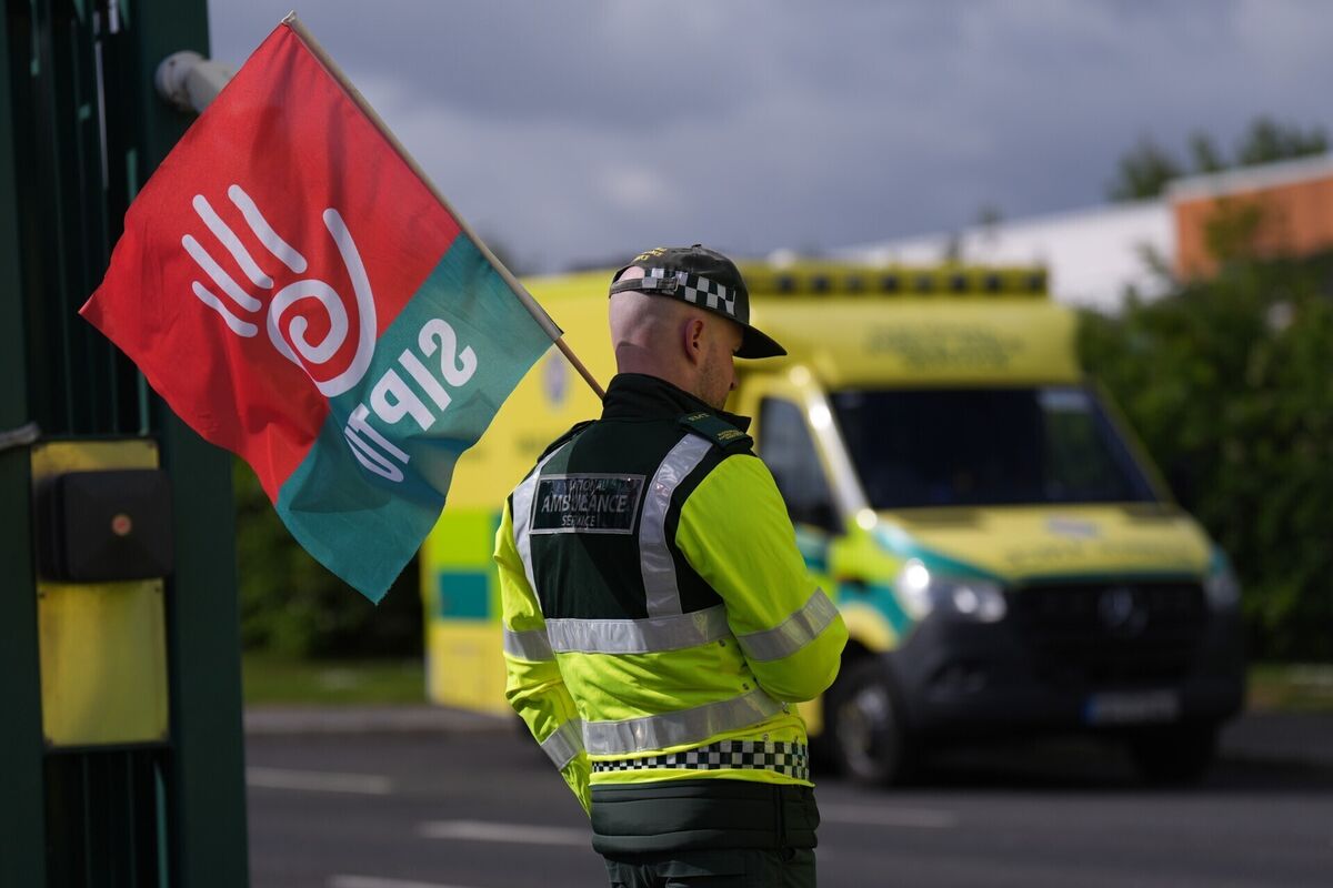 A picketer outside National Ambulance Service depot at Davitt Road in Dublin. Picture: Niall Carson/PA A picketer outside National Ambulance Service depot at Davitt Road in Dublin. Picture: Niall Carson/PA