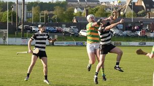 <p>Midleton's Seán O’Sullivan and Kevin O’Keefe battle for a high ball. Pic: Noel Sweeney</p>