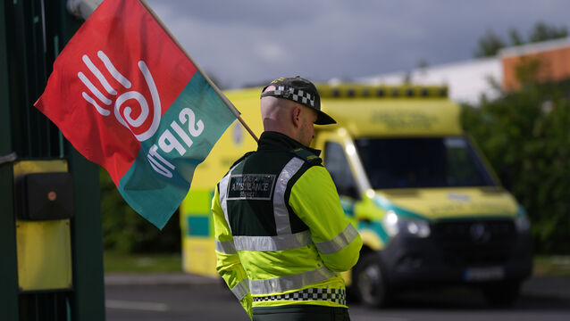 <p>Members of Siptu and Unite unions on the picket line outside the National Ambulance Service depot at Davitt Road in Dublin, on Tuesday. Picture: Niall Carson/PA</p>
