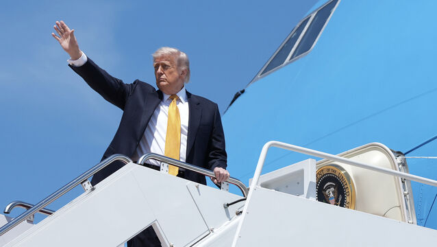 <p>President Donald Trump boards Air Force One on Tuesday (Mark Schiefelbein/AP)</p>