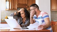 Couple receiving home bills