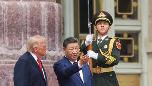 Chinese President Xi Jinping attends a welcome ceremony with US President Donald Trump, left, at the Great Hall of the People in Beijing (Maxim Shemetov/Pool Photo/AP)