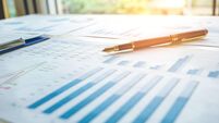 Pen  on the business paper. Report chart